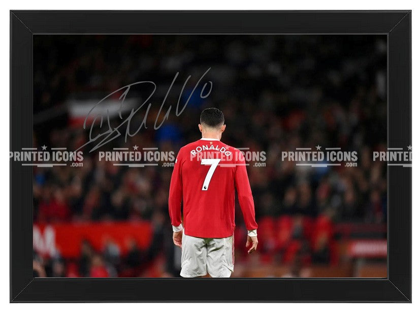 Signed (printed photo) of  Cristiano Ronaldo playing for Manchester United. A printed autograph taken from a genuine, certified (certificate of authenticity) autograph. A stunning signature. The print is available in a range of sizes with various framing options available. Cristiano Ronaldo is the all time GOAT, having played for Real Madrid, Juventus and Al-Nassr. He is also an icon for Portugal.