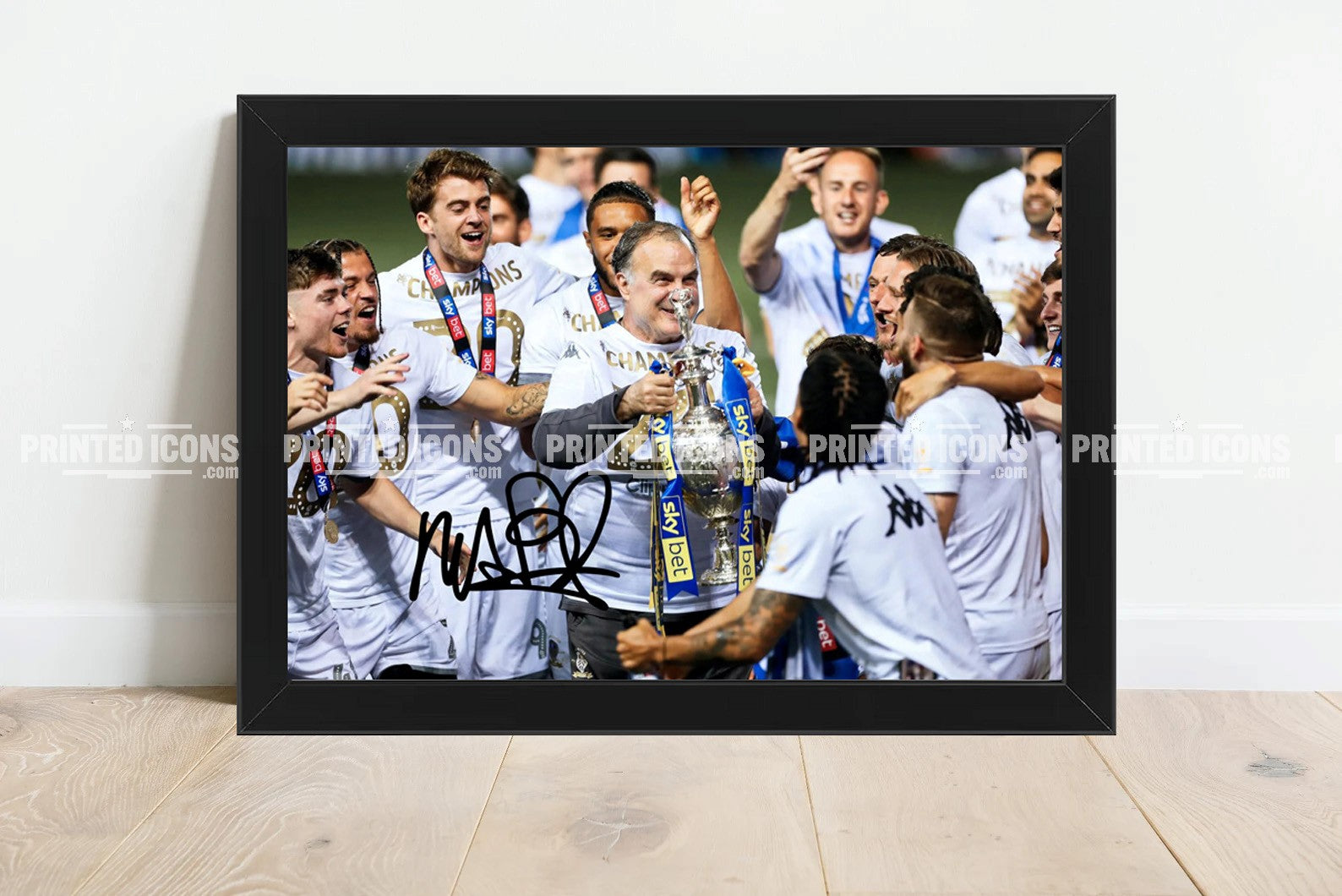 Signed (printed photo) of Marcelo Bielsa managing Leeds United. He is lifting the 2020 Championship trophy. A printed autograph taken from a genuine, certified (certificate of authenticity) autograph. A stunning signature. The print is available in a range of sizes with various framing options available.  Marcelo Bielsa is famous for sitting on his iconic blue bucket. 
