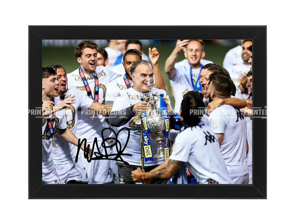 Marcelo Bielsa holding Championship trophy with Leeds United team signed photo print