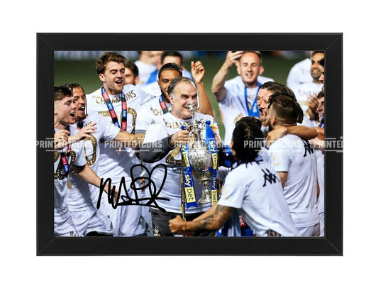 Marcelo Bielsa holding Championship trophy with Leeds United team signed photo print