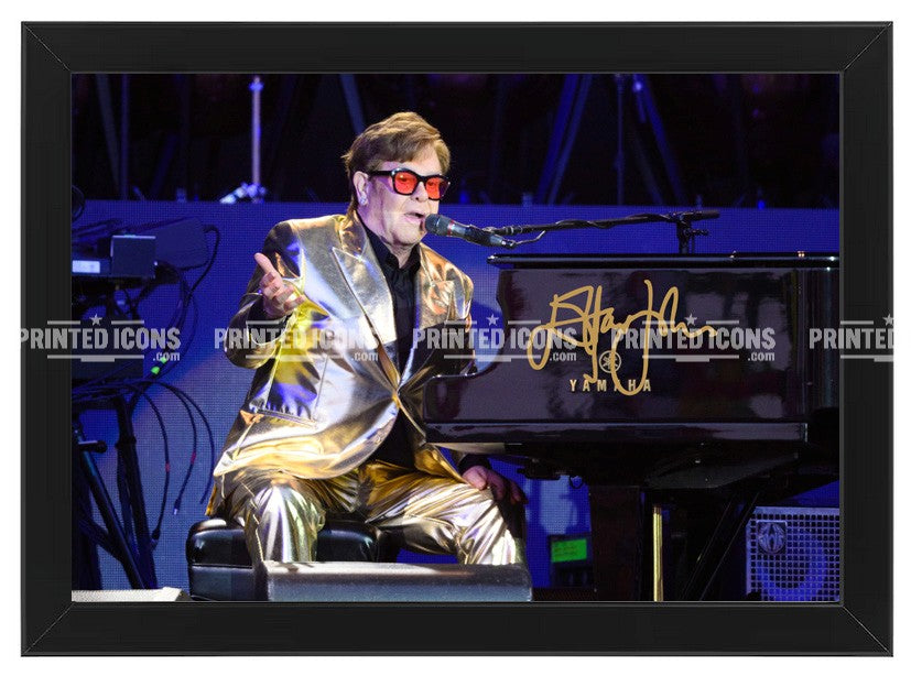 Signed (printed photo) of Elton John. A printed autograph taken from a genuine, certified (certificate of authenticity) autograph. A stunning signature. The print is available in a range of sizes with various framing options available. Yellow Brick Road final tour.