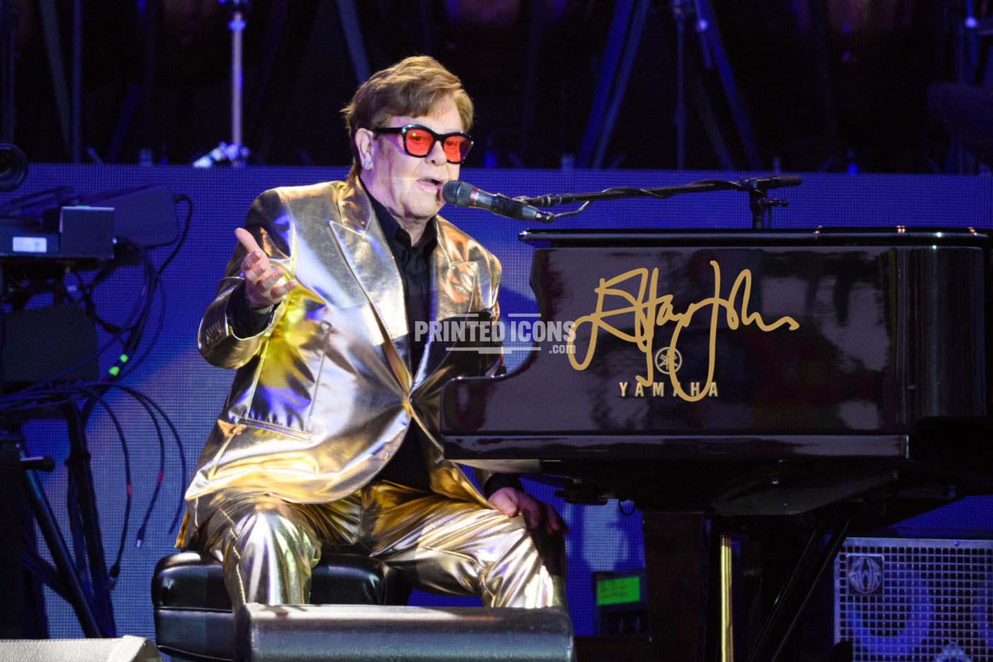 Signed (printed photo) of Elton John. A printed autograph taken from a genuine, certified (certificate of authenticity) autograph. A stunning signature. The print is available in a range of sizes with various framing options available. Yellow Brick Road final tour.