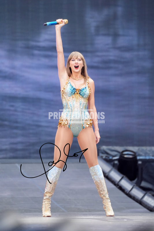 Signed (printed photo) of Taylor Swift from  her Eras Tour. A printed autograph taken from a genuine, certified (certificate of authenticity) Taylor Swift autograph. A stunning signature. The print is available in a range of sizes with various framing options available. 