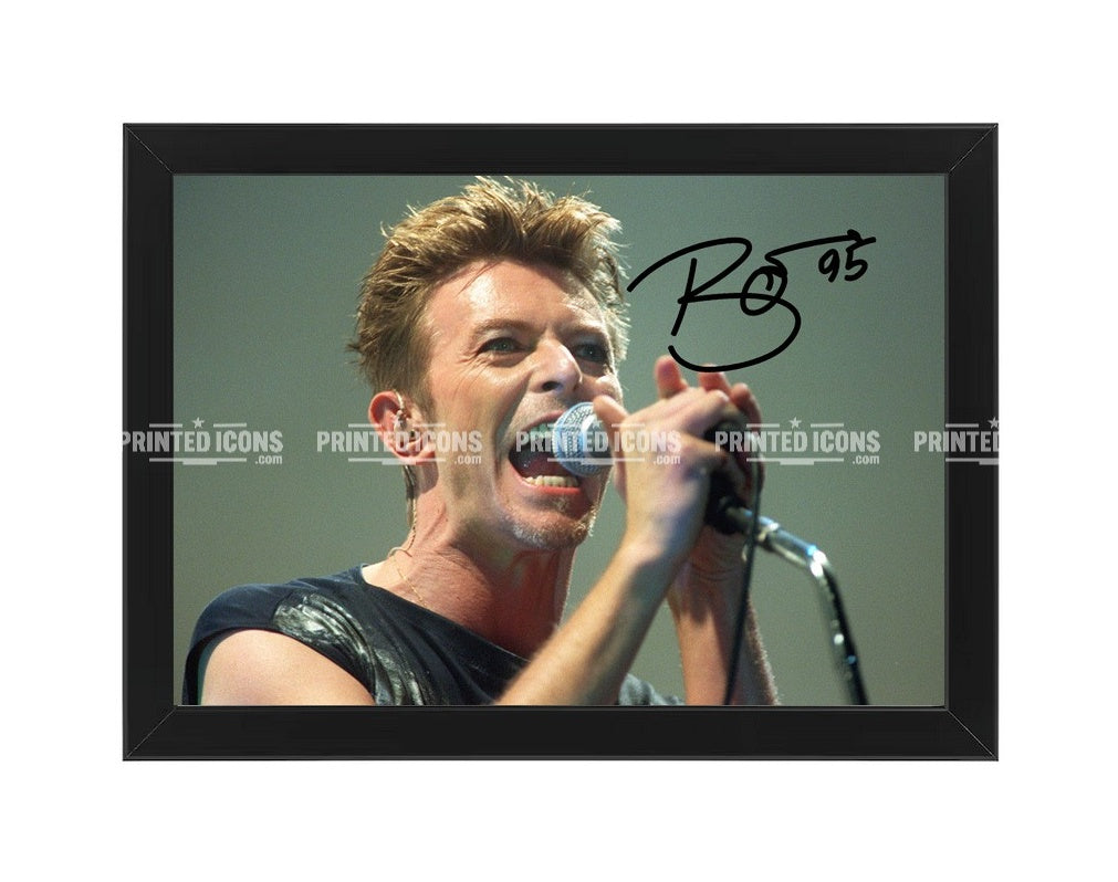 Signed (printed photo) of David Bowie. A printed autograph taken from a genuine, certified (certificate of authenticity) David Bowie autograph. A stunning signature. The print is available in a range of sizes with various framing options available.