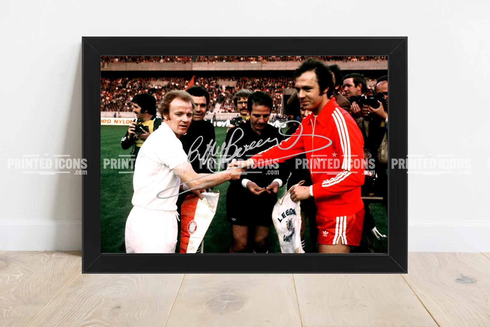 Signed (printed photo) of Billy Bremner and Franz Beckenbauer before the 1975 European Cup Final.  A printed autograph taken from a genuine, certified (certificate of authenticity)  autograph. A stunning signature. The print is available in a range of sizes with various framing options available. A framed photo version is the perfect gift for any fan.