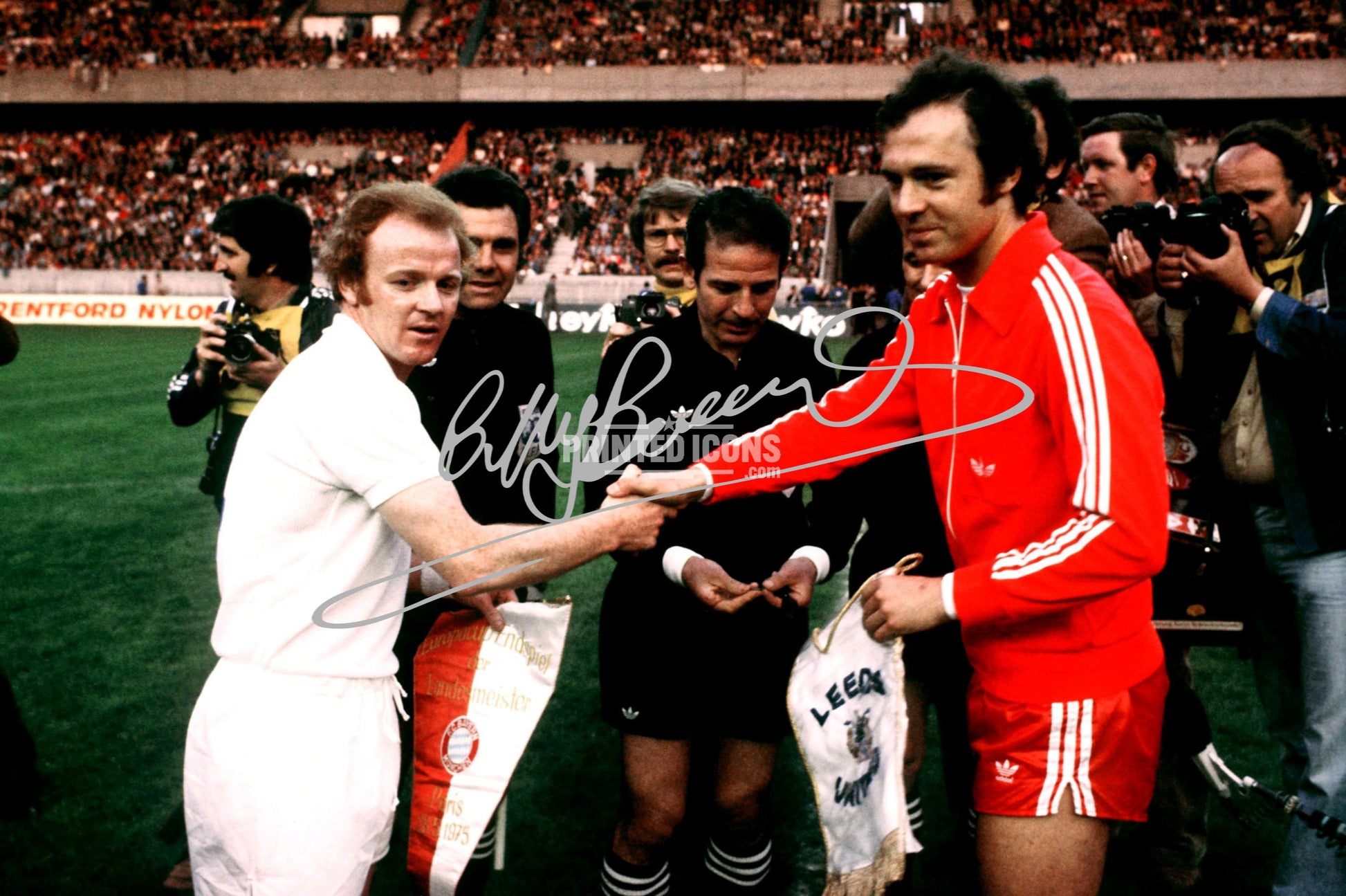 Signed (printed photo) of Billy Bremner and Franz Beckenbauer before the 1975 European Cup Final.  A printed autograph taken from a genuine, certified (certificate of authenticity)  autograph. A stunning signature. The print is available in a range of sizes with various framing options available. A framed photo version is the perfect gift for any fan.