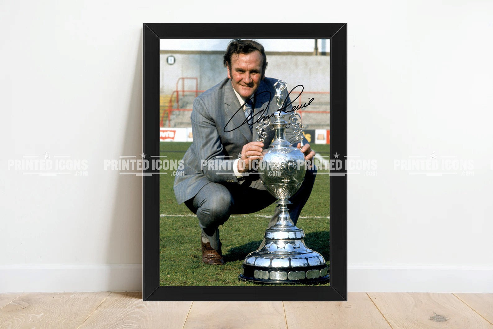 Signed (printed autograph) photo of Don Revie with the 1974 League Cup.  A printed autograph taken from a genuine, certified (certificate of authenticity)  autograph. A stunning signature. The print is available in a range of sizes with various framing options available. A framed photo version is the perfect gift for any fan.