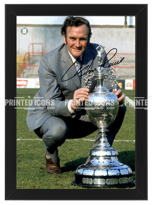 Signed (printed autograph) photo of Don Revie with the 1974 League Cup.  A printed autograph taken from a genuine, certified (certificate of authenticity)  autograph. A stunning signature. The print is available in a range of sizes with various framing options available. A framed photo version is the perfect gift for any fan.