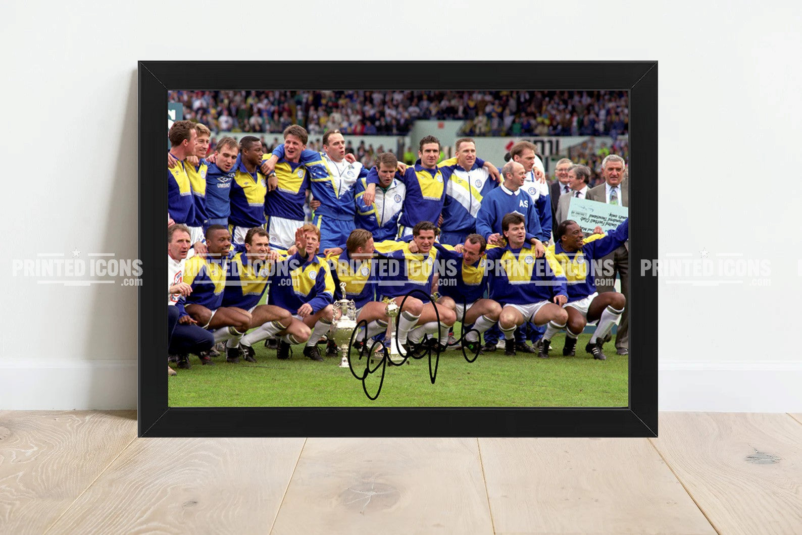 Signed (printed autograph) photo of Gary Speed holding the 1992 First Division Champions trophy for Leeds United.  A printed autograph taken from a genuine, certified (certificate of authenticity)  autograph. A stunning signature. The print is available in a range of sizes with various framing options available. A framed photo version is the perfect gift for any fan.