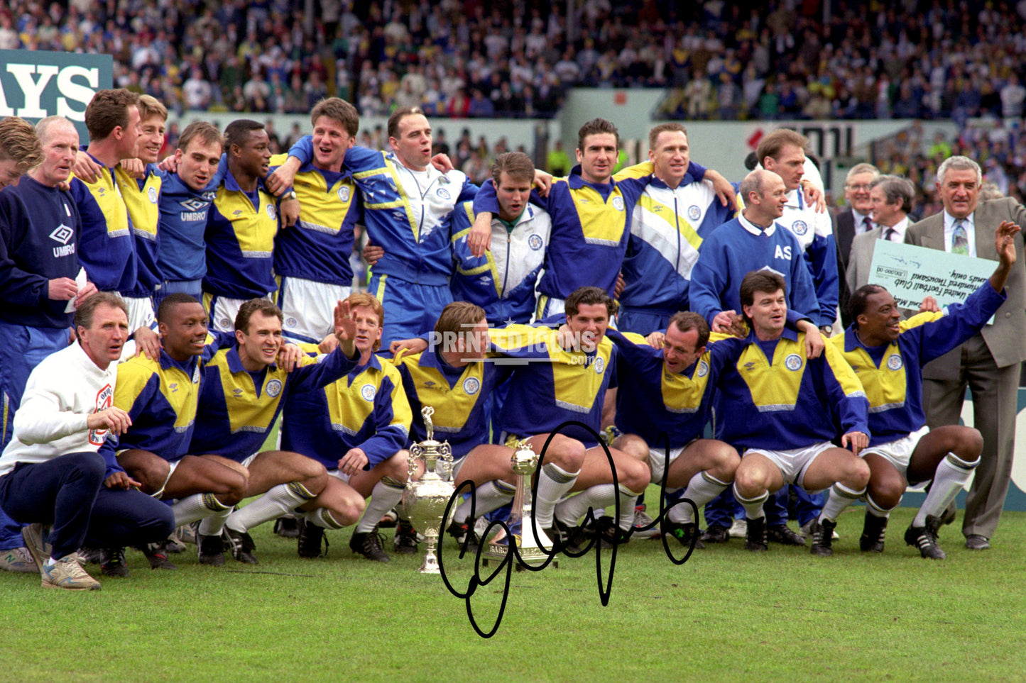 Signed (printed autograph) photo of Gary Speed holding the 1992 First Division Champions trophy for Leeds United.  A printed autograph taken from a genuine, certified (certificate of authenticity)  autograph. A stunning signature. The print is available in a range of sizes with various framing options available. A framed photo version is the perfect gift for any fan.