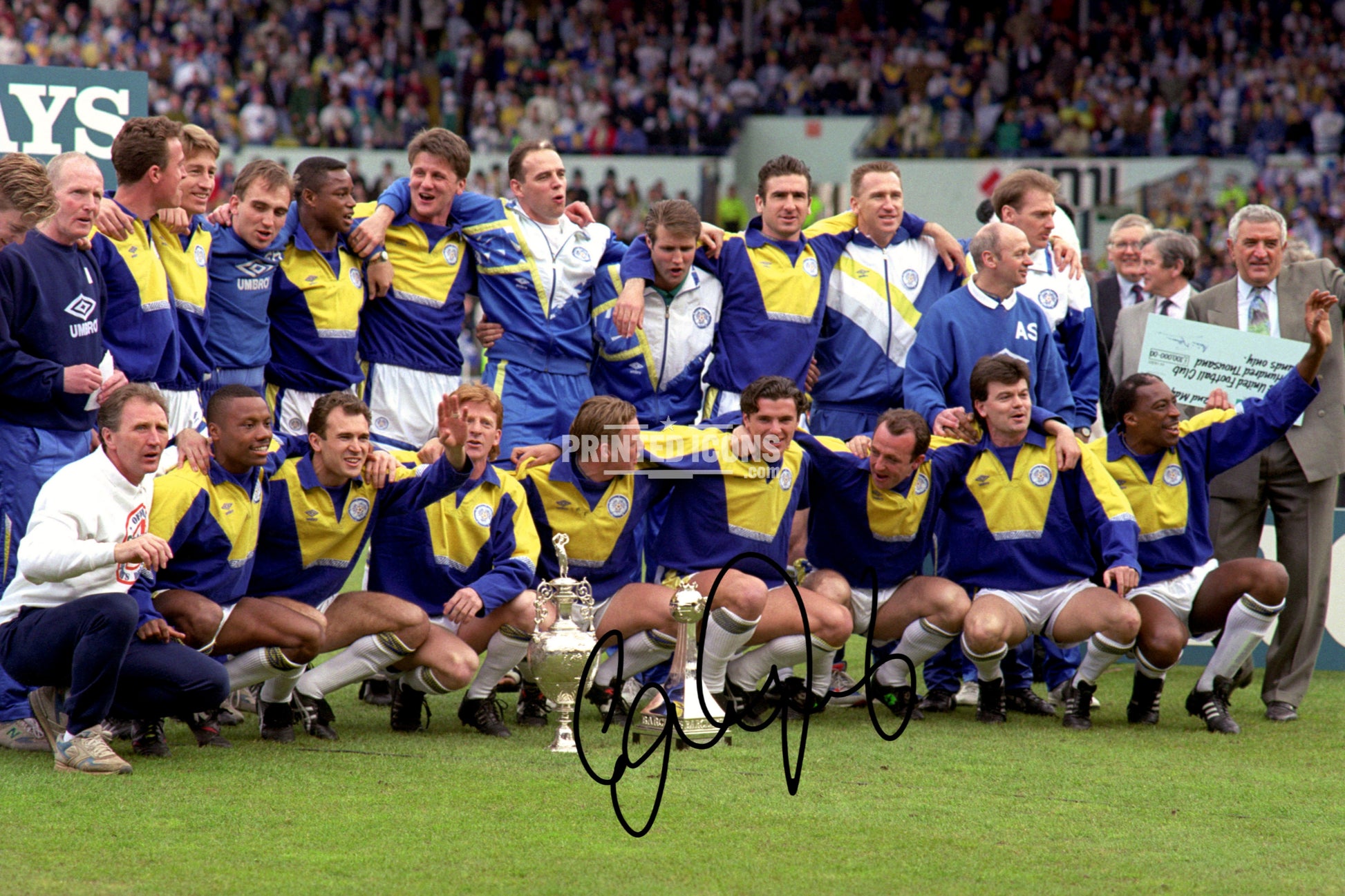 Signed (printed autograph) photo of Gary Speed holding the 1992 First Division Champions trophy for Leeds United.  A printed autograph taken from a genuine, certified (certificate of authenticity)  autograph. A stunning signature. The print is available in a range of sizes with various framing options available. A framed photo version is the perfect gift for any fan.