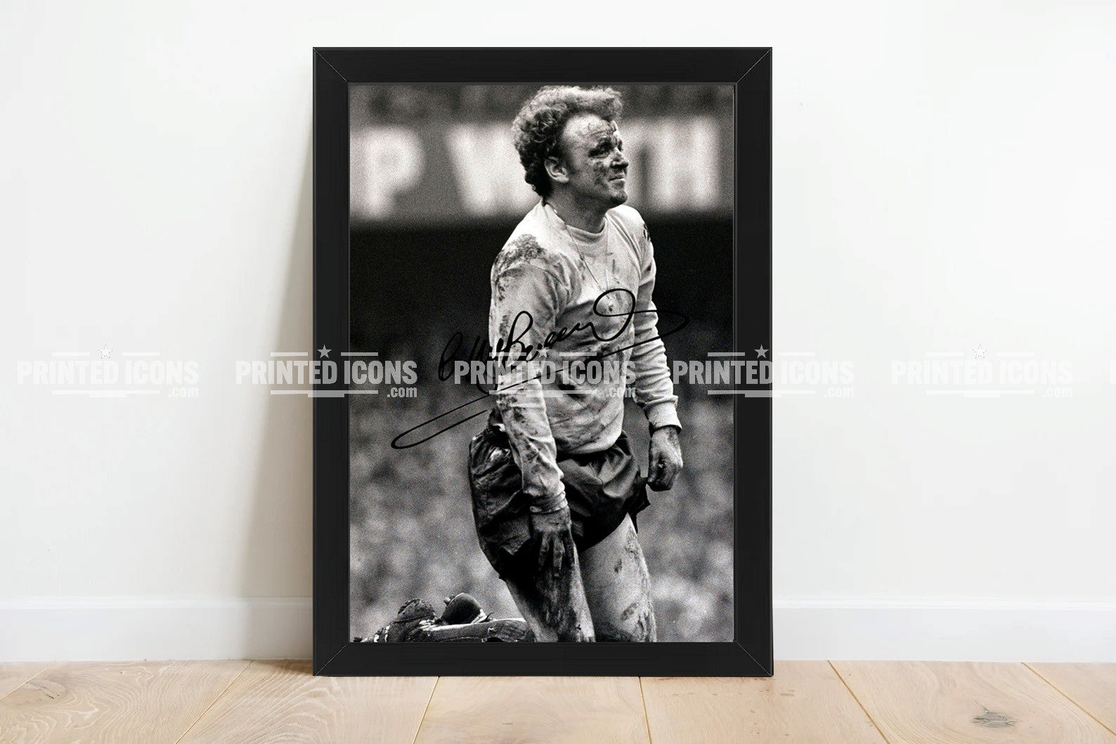 Billy Bremner in the mud signed photo. A printed autograph (from a certified original) on a Leeds United photo. Framing Available. A great gift for a Leeds United fan.
