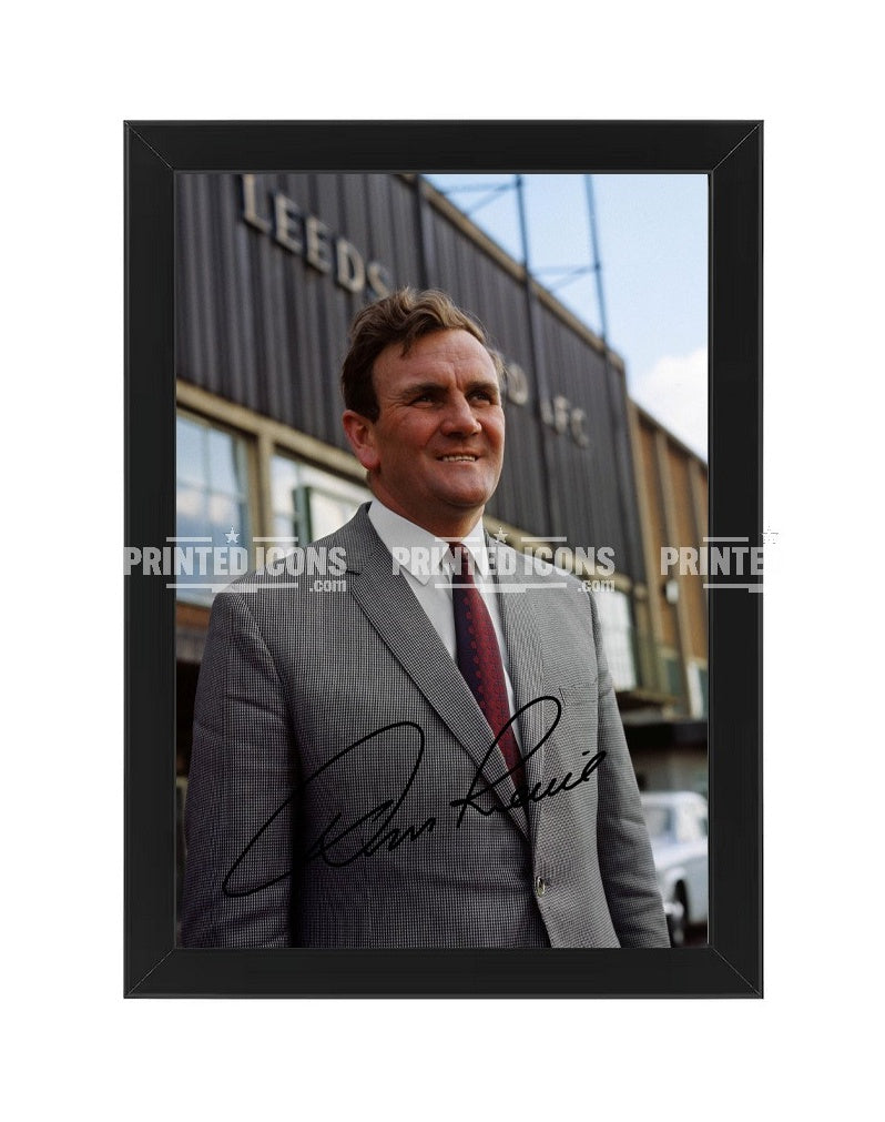 Signed (printed autograph) photo of Don Revie with the 1974 League Cup.  A printed autograph taken from a genuine, certified (certificate of authenticity)  autograph. A stunning signature. The print is available in a range of sizes with various framing options available. A framed photo version is the perfect gift for any fan.