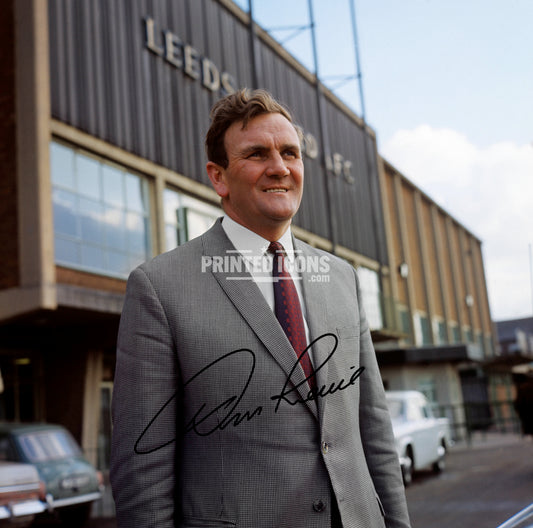Signed (printed autograph) photo of Don Revie with the 1974 League Cup.  A printed autograph taken from a genuine, certified (certificate of authenticity)  autograph. A stunning signature. The print is available in a range of sizes with various framing options available. A framed photo version is the perfect gift for any fan.