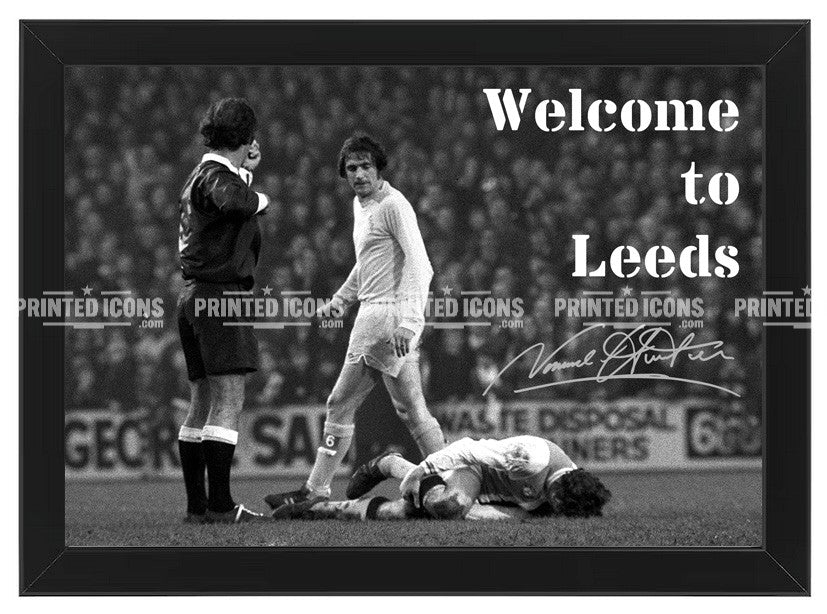 Signed (printed autograph) of Norman Hunter, Leeds United, after the iconic tackle on Franny Lee. The image is captioned 'Welcome to Leeds'. A printed autograph taken from a genuine, certified (certificate of authenticity)  autograph. A stunning signature. The print is available in a range of sizes with various framing options available. A framed photo version is the perfect gift for any fan.