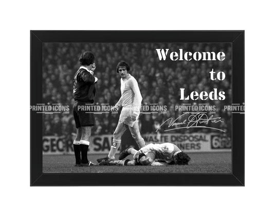 Signed (printed autograph) of Norman Hunter, Leeds United, after the iconic tackle on Franny Lee. The image is captioned 'Welcome to Leeds'. A printed autograph taken from a genuine, certified (certificate of authenticity)  autograph. A stunning signature. The print is available in a range of sizes with various framing options available. A framed photo version is the perfect gift for any fan.