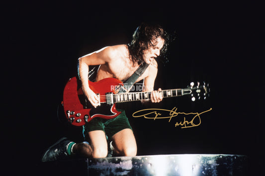 Angus Young signed AC/DC photo print playing guitar with reproduced autograph