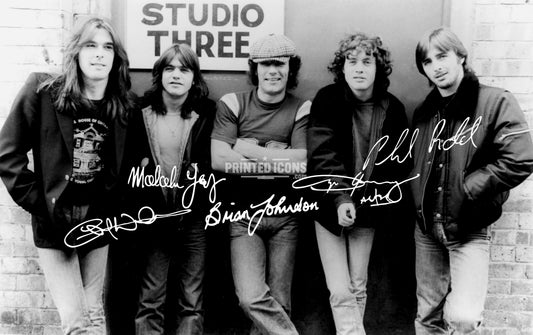 AC/DC signed band photo with reproduced Angus Young Brian Johnson and band autographs