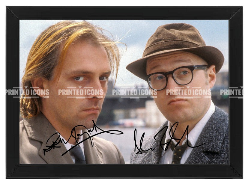 Rik Mayall and Ade Edmondson signed photo print from Bottom with printed autographs. Black frame