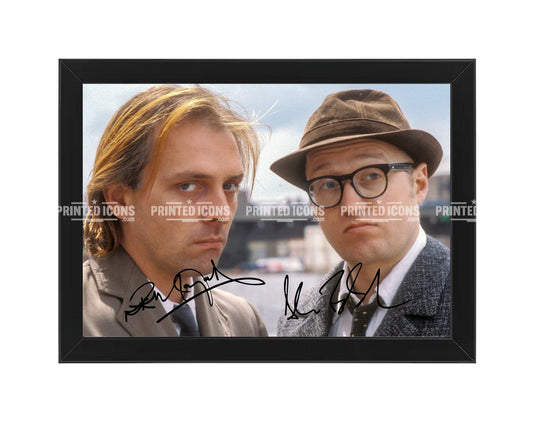 Rik Mayall and Ade Edmondson signed photo print from Bottom with printed autographs. Black frame