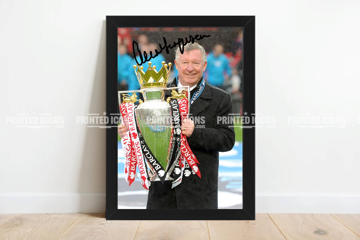 Sir Alex Ferguson holding Premier League trophy with reproduced autograph