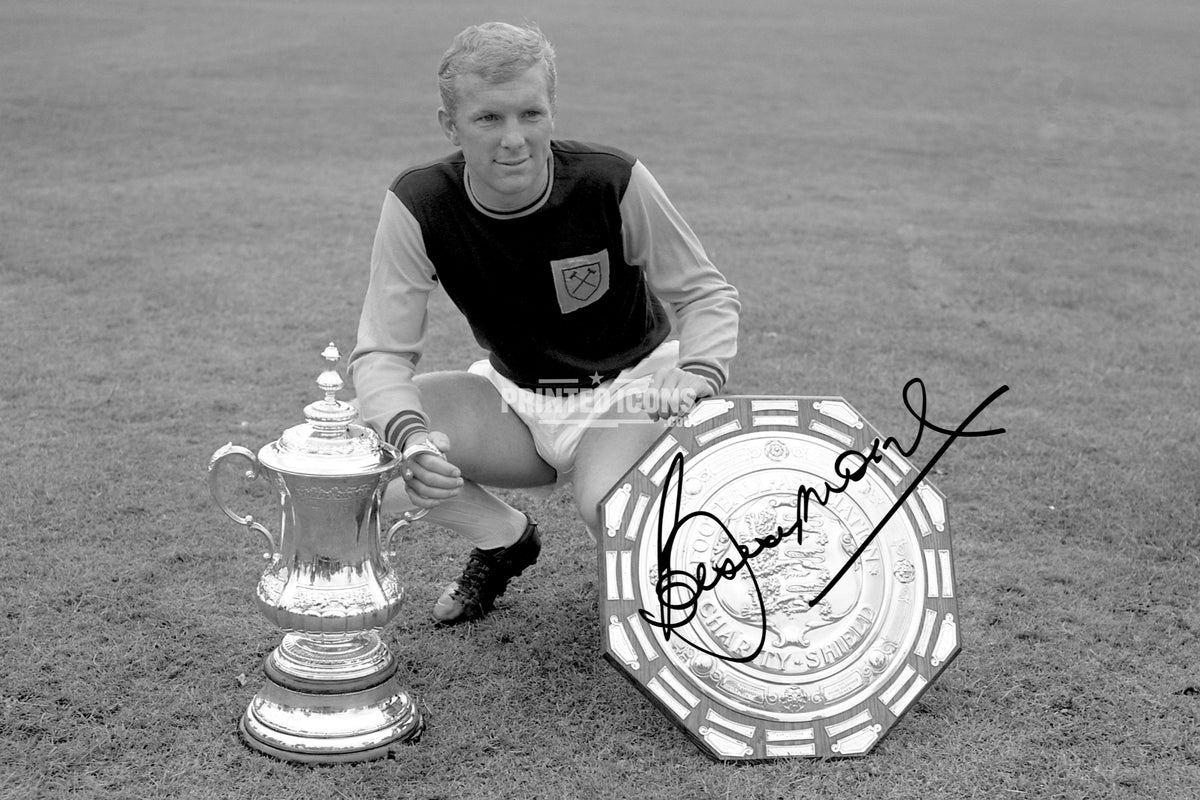 Bobby Moore signed West Ham photo with FA Cup and Charity Shield