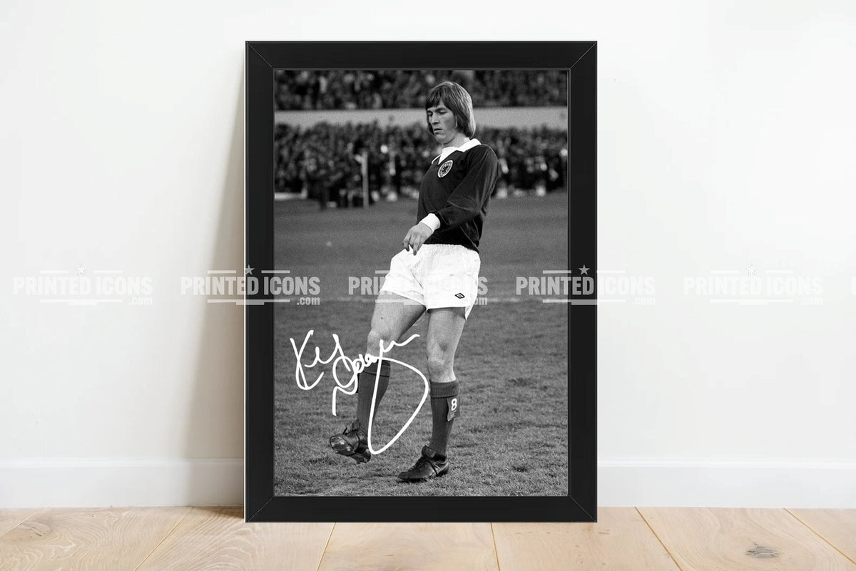 Framed Kenny Dalglish Scotland signed football print displayed against white wall